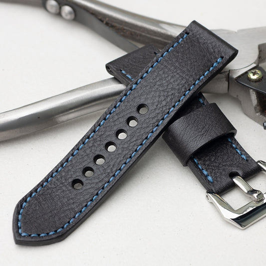 Raven leather watch strap with royal blue stitching and polished steel buckle