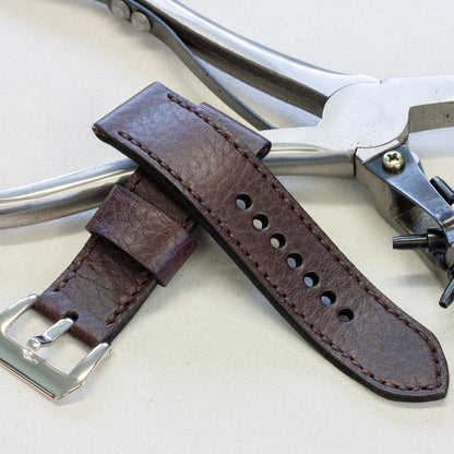 Aegir leather watch strap with dark brown stitching and polished steel buckle