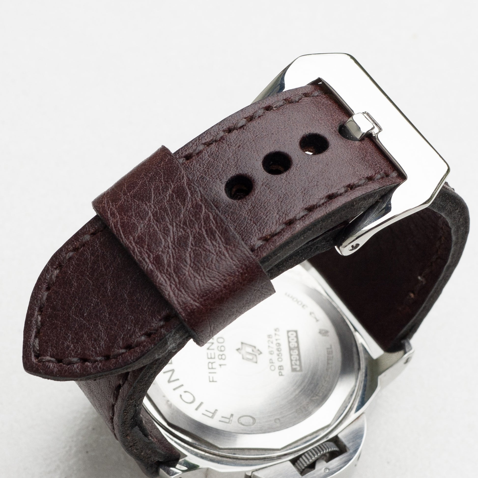Aegir leather watch strap with dark brown stitching and polished steel buckle