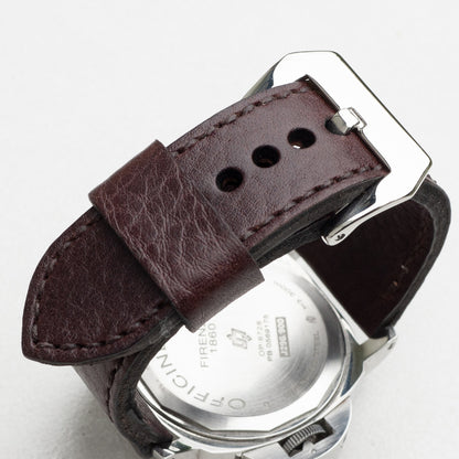Aegir leather watch strap with dark brown stitching and polished steel buckle