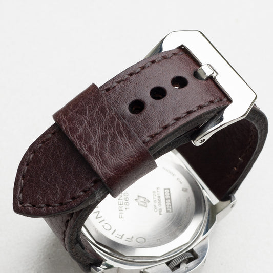 Aegir leather watch strap with dark brown stitching and polished steel buckle