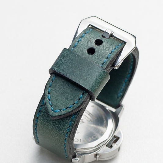 Aqua leather watch strap with teal stitching and polished steel buckle