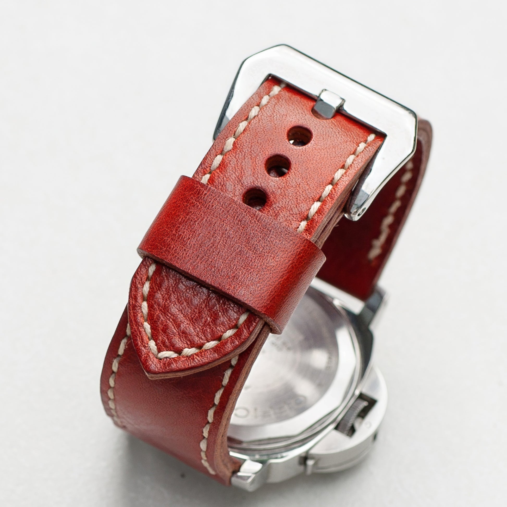 Arancio leather watch strap with natural stitching and polished steel buckle