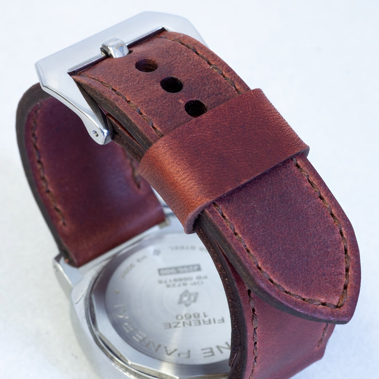Autumn Leaf leather watch strap with light brown stitching and polished steel buckle