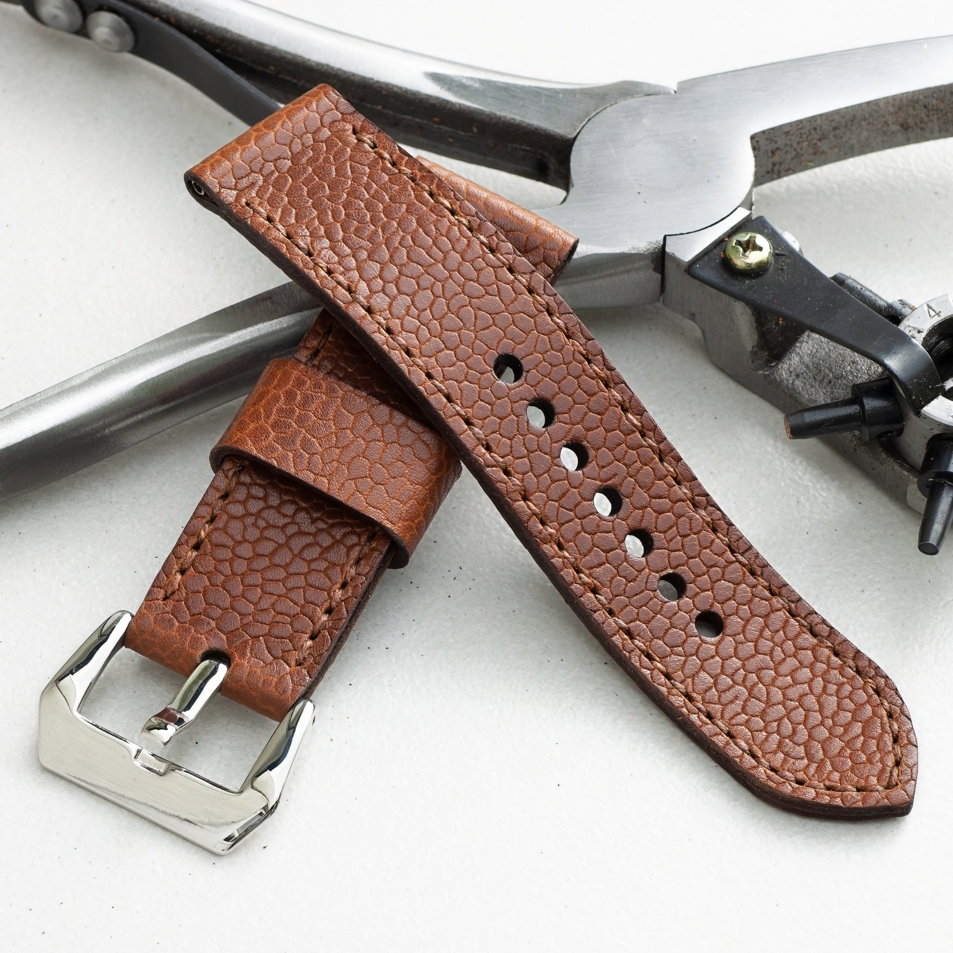 Bacchus leather watch strap with light brown stitching and polished steel buckle