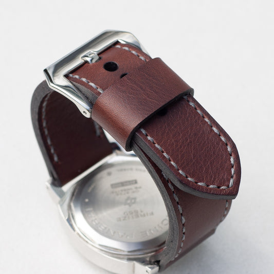 Brutal leather watch strap with grey stitching and polished steel buckle