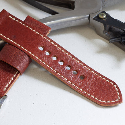 Burnt Sienna leather watch strap with natural stitching and polished steel buckle