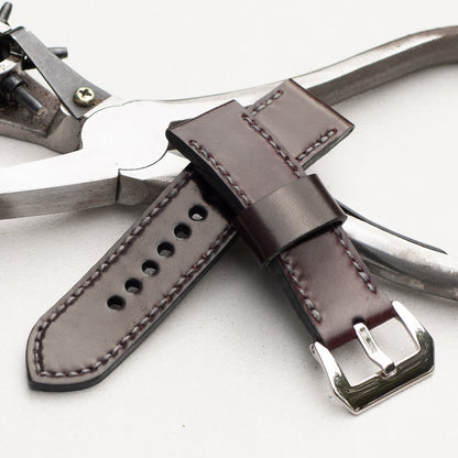Burgundy Shell Cordovan leather watch strap with grey stitching and polished steel buckle