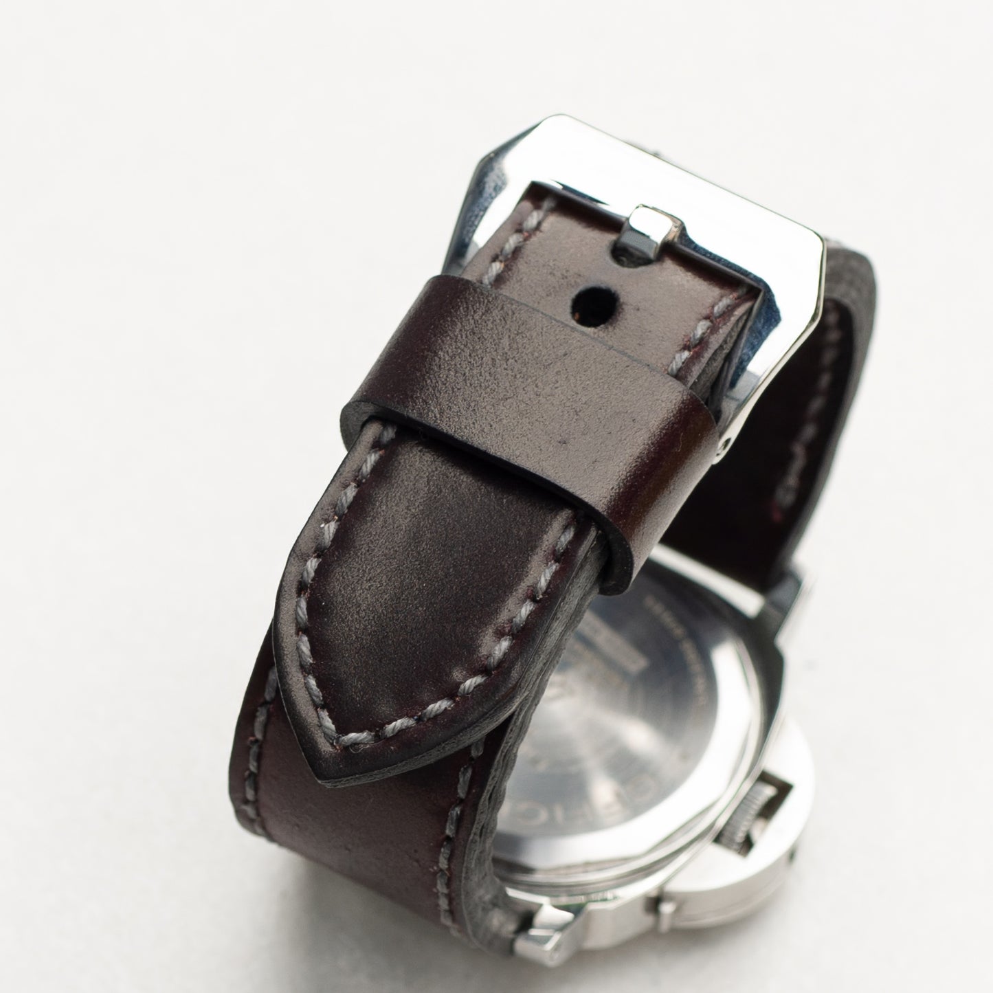 Burgundy Shell Cordovan leather watch strap with grey stitching and polished steel buckle