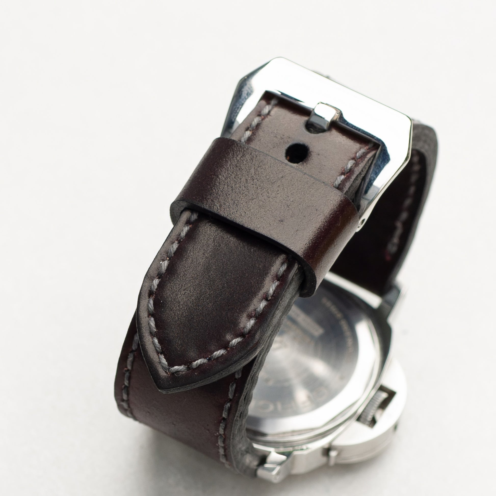 Burgundy Shell Cordovan leather watch strap with grey stitching and polished steel buckle