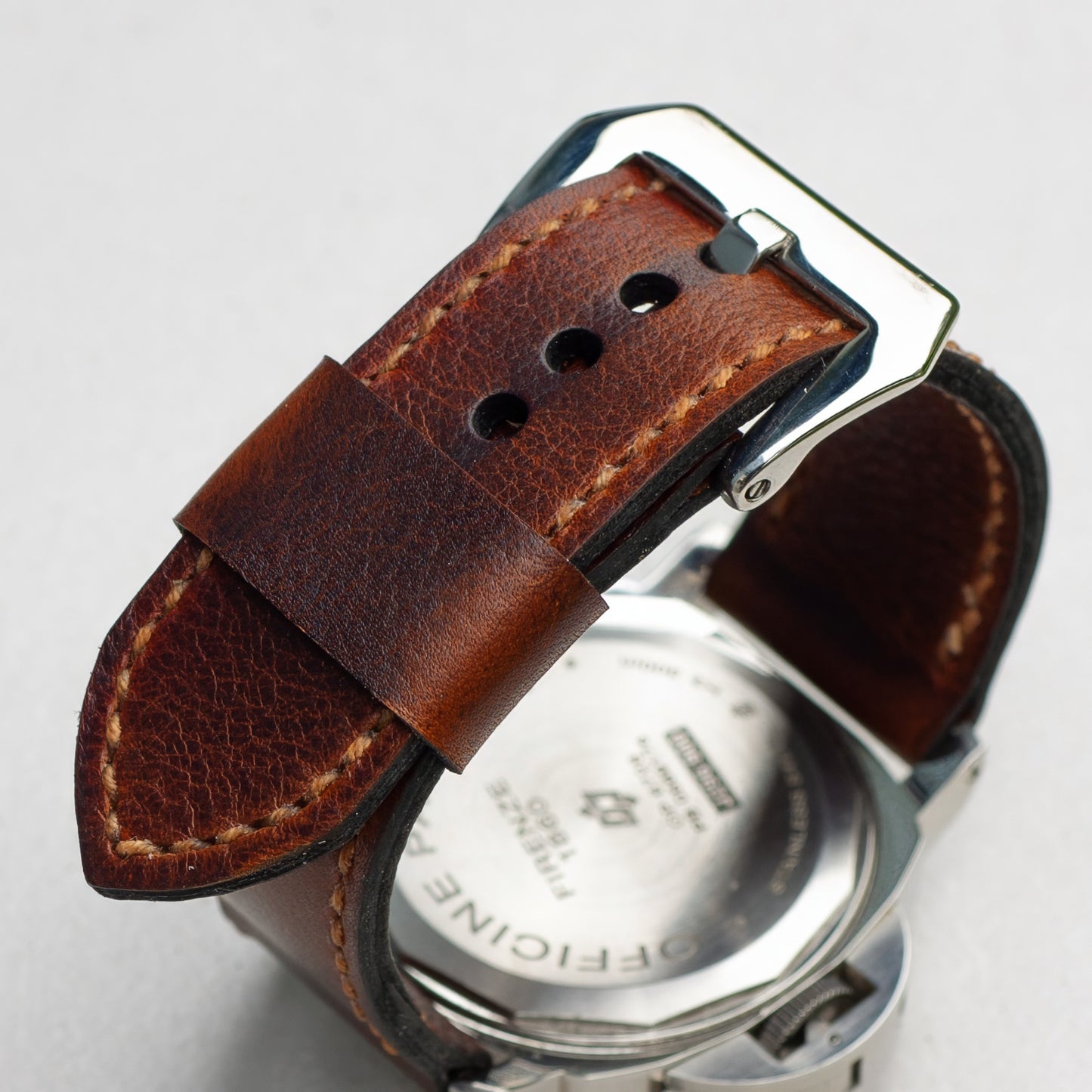 Cerberus leather watch strap with butterscotch stitching and polished steel buckle