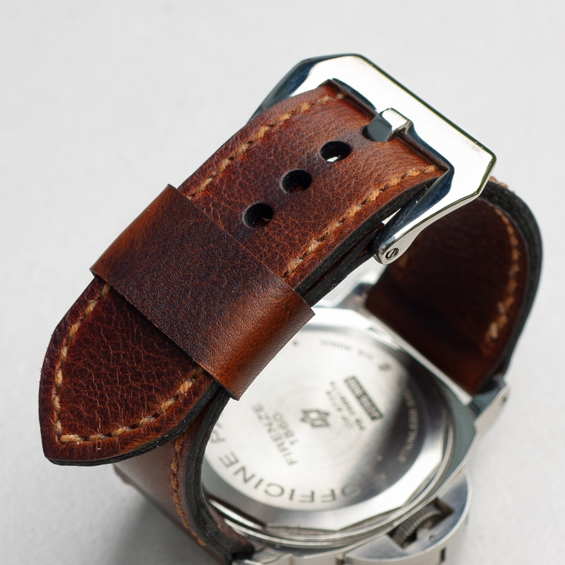 Cerberus leather watch strap with butterscotch stitching and polished steel buckle