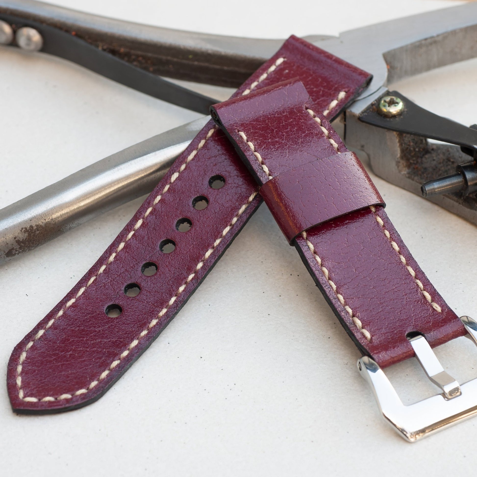 Cherry Bomb leather watch strap with natural stitching and polished steel buckle