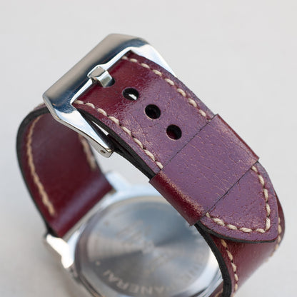 Cherry Bomb leather watch strap with natural stitching and polished steel buckle
