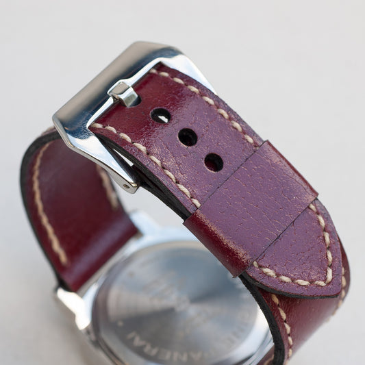 Cherry Bomb leather watch strap with natural stitching and polished steel buckle