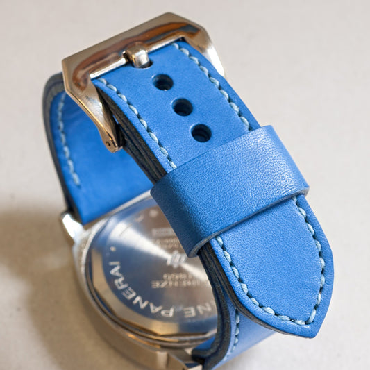 Cobalt Blue leather watch strap with pale blue stitching and polished steel buckle