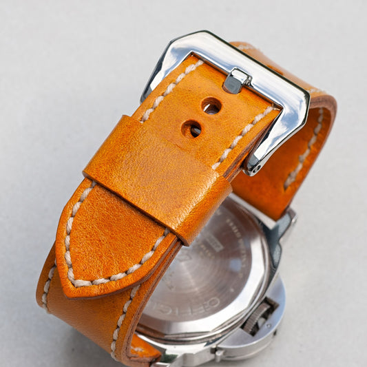 Crema leather watch strap with natural stitching and polished steel buckle