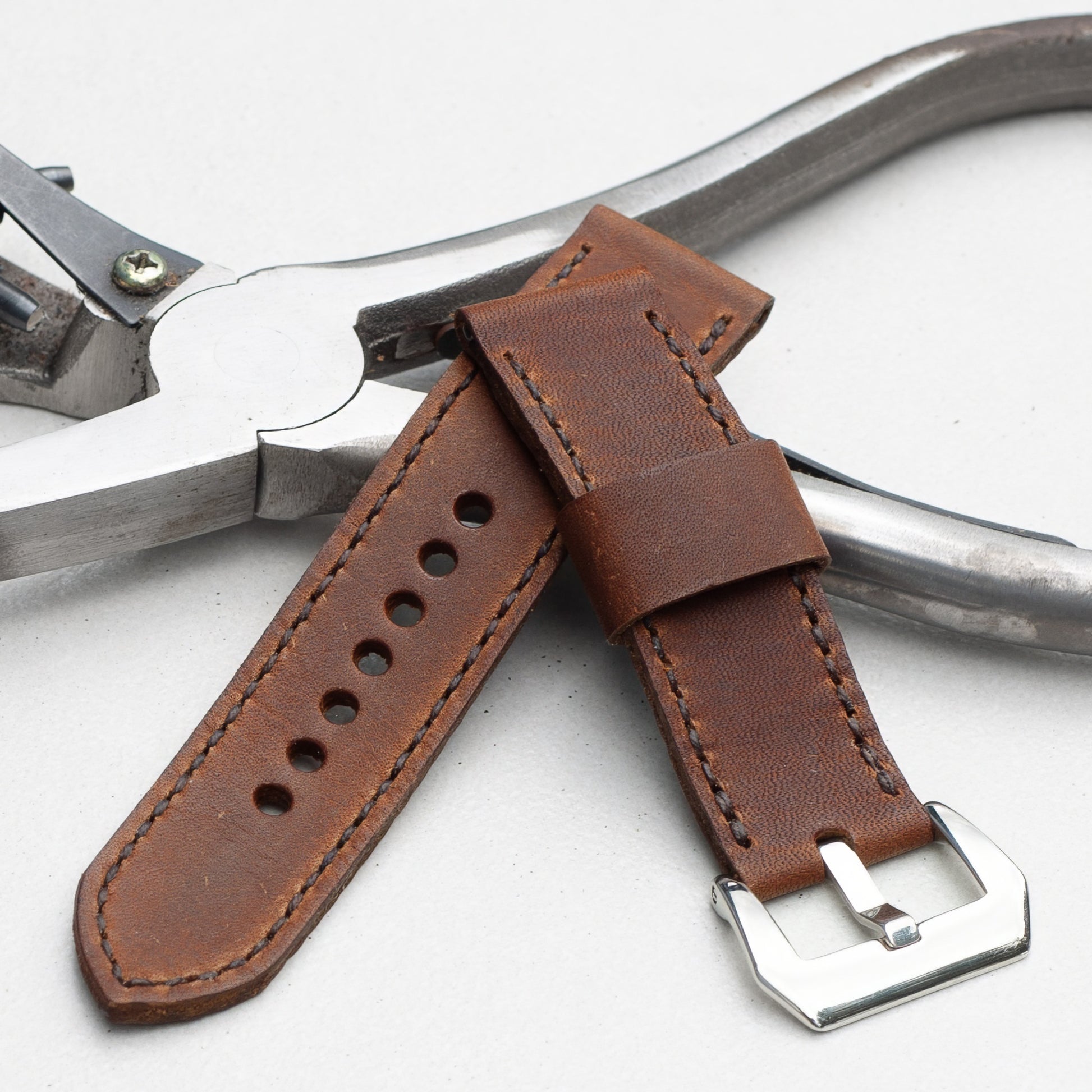 Dakota leather watch strap with dark brown stitching and polished steel buckle