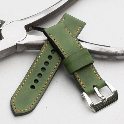 Emerald leather watch strap with butterscotch stitching and polished steel buckle