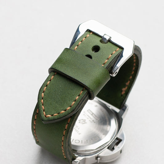 Emerald leather watch strap with butterscotch stitching and polished steel buckle