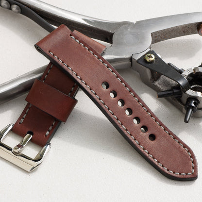 Espresso leather watch strap with grey stitching and polished steel buckle