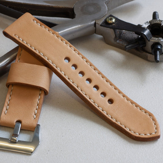 Horween Essex leather watch strap with natural stitching and polished steel buckle