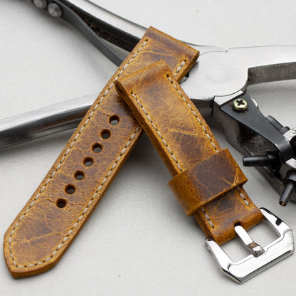 Ginger leather watch strap with natural stitching and polished steel buckle