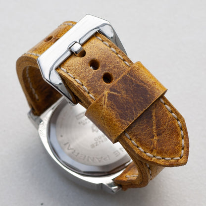 Ginger leather watch strap with natural stitching and polished steel buckle