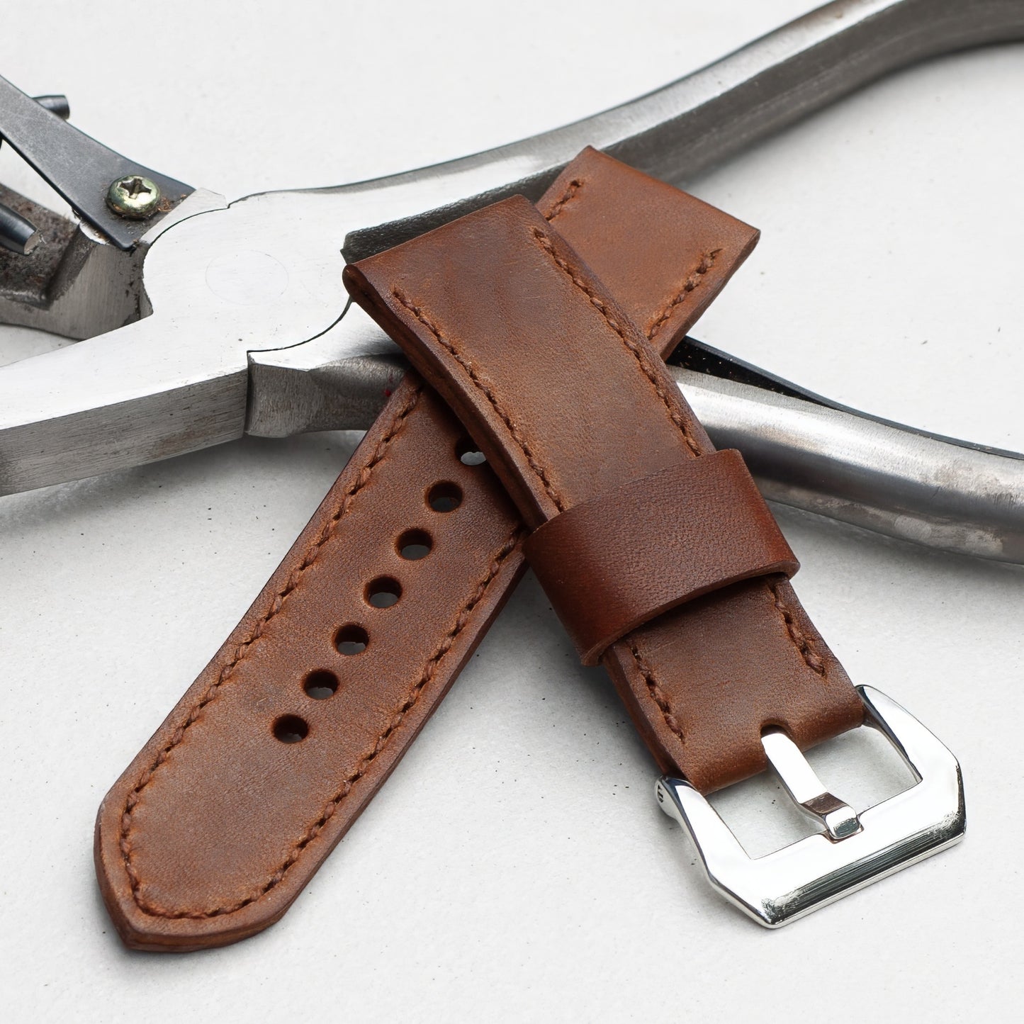 Heavy Horse leather watch strap with light brown stitching and polished steel buckle