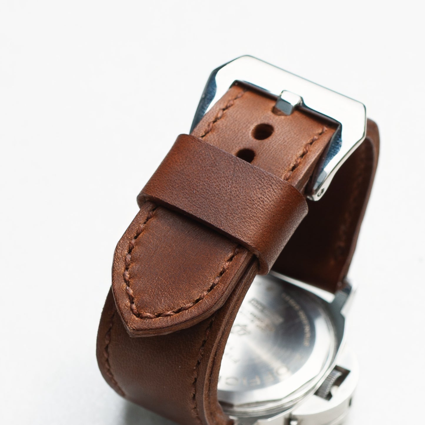Heavy Horse leather watch strap with light brown stitching and polished steel buckle