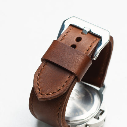 Heavy Horse leather watch strap with light brown stitching and polished steel buckle