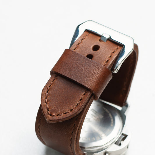 Heavy Horse leather watch strap with light brown stitching and polished steel buckle