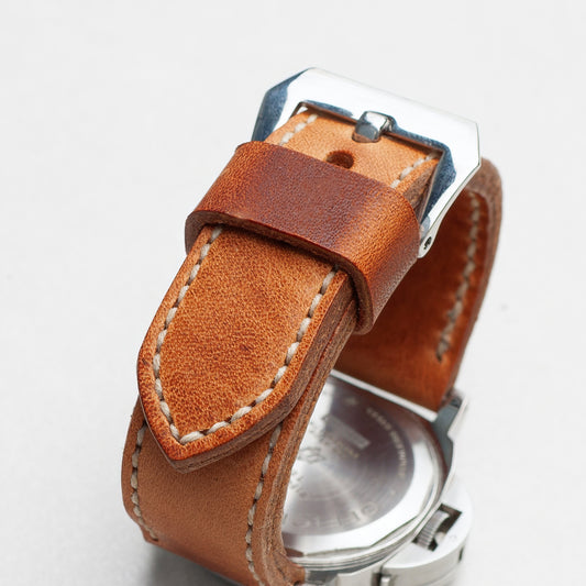 Horween Derby leather watch strap with natural stitching and polished steel buckle