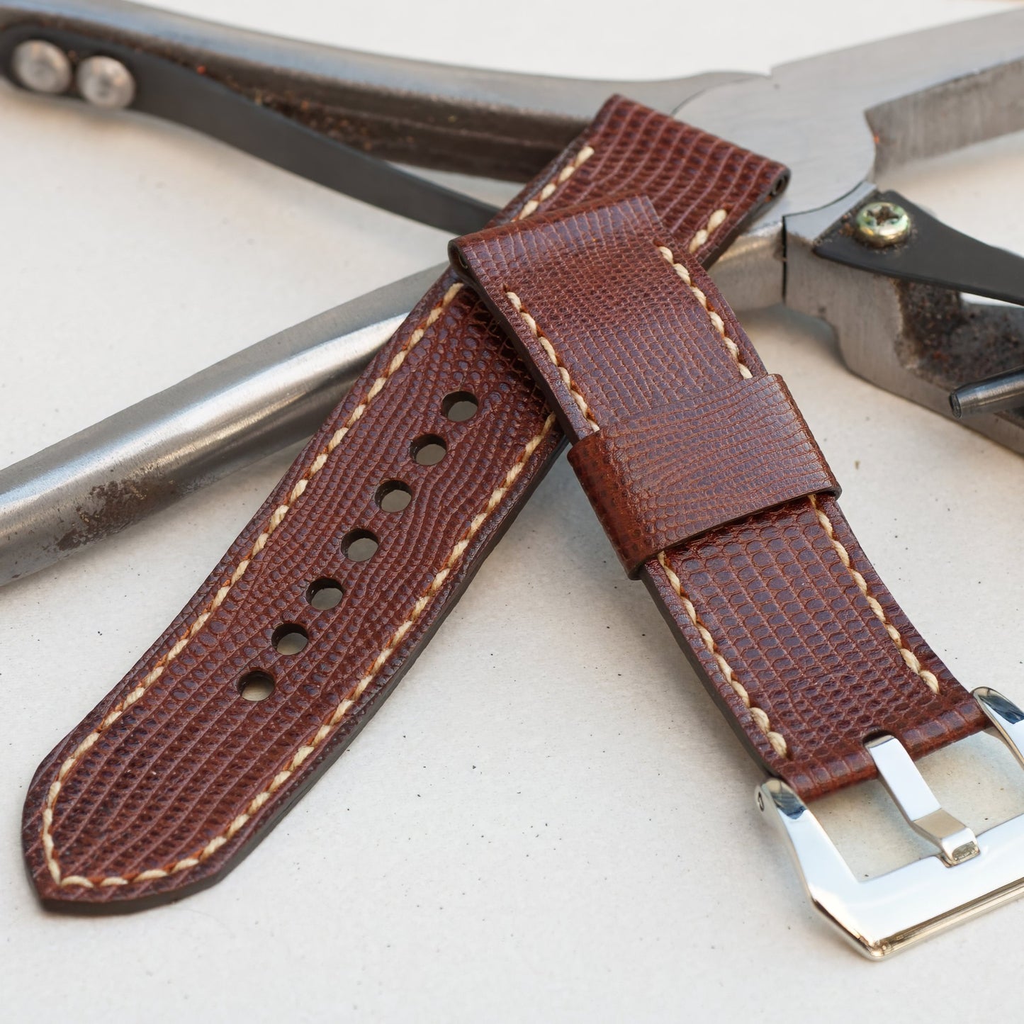 Iguana leather watch strap with natural stitching and polished steel buckle