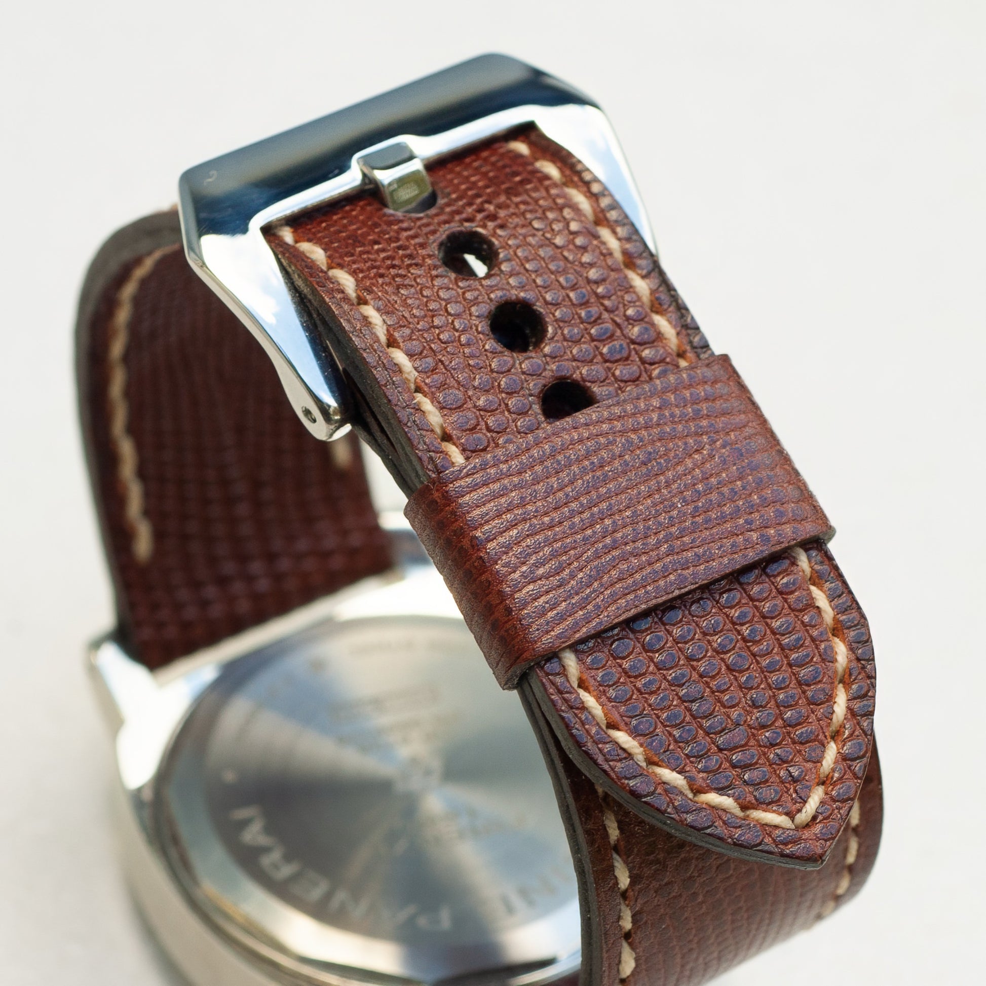 Iguana leather watch strap with natural stitching and polished steel buckle