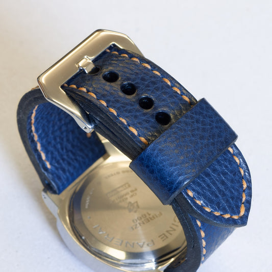 Indigo leather watch strap with butterscotch stitching and polished steel buckle