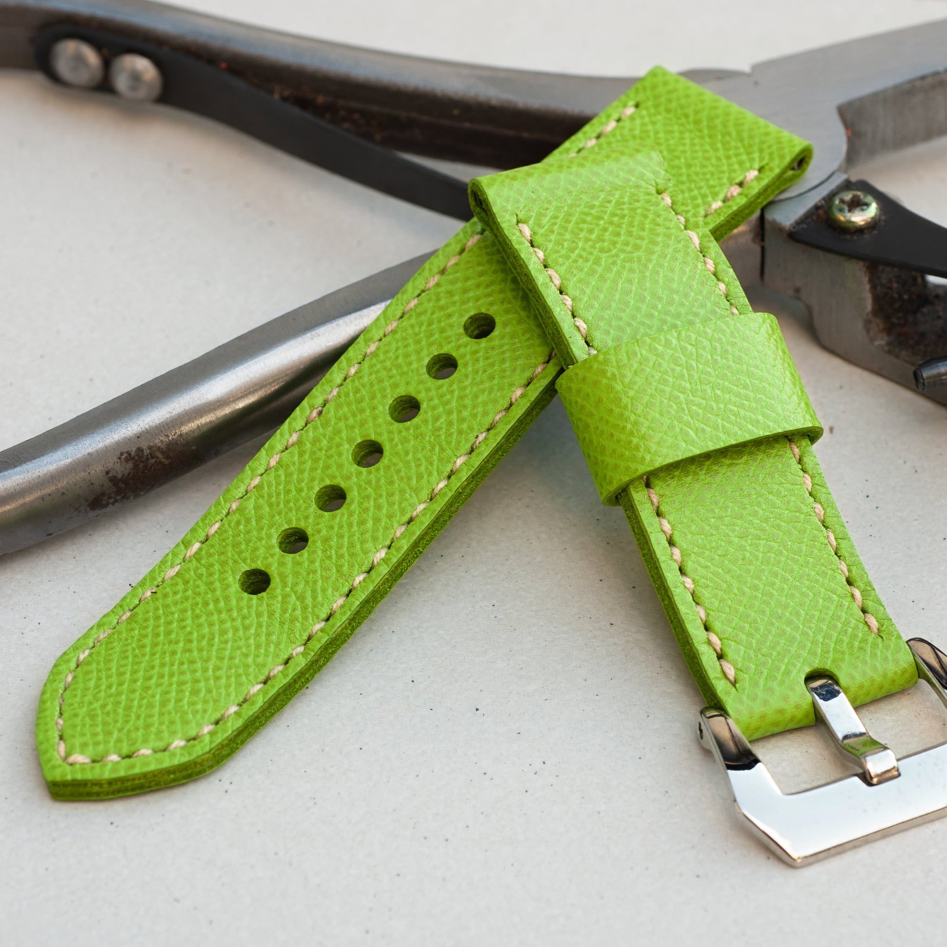 Kiwi leather watch strap with natural stitching and polished steel buckle
