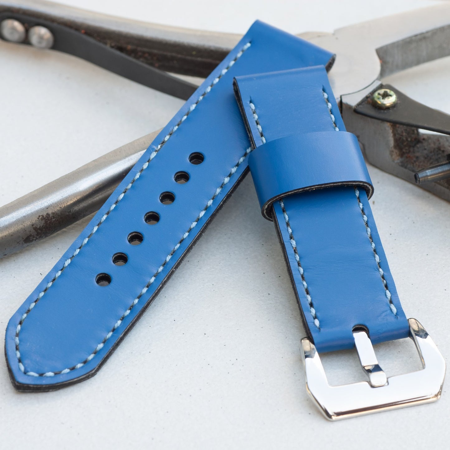 Marlin leather watch strap with pale blue stitching and polished steel buckle