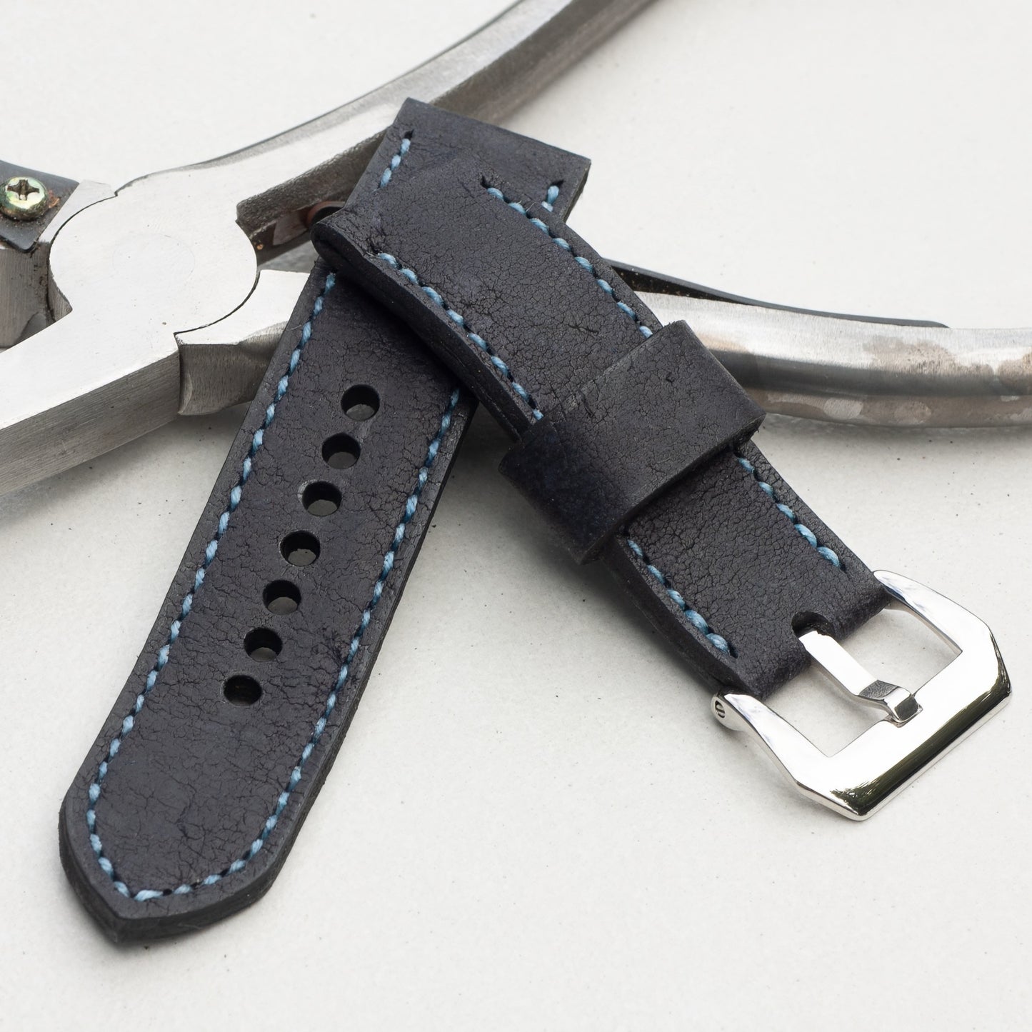 Midnight Kudu leather watch strap with pale blue stitching and polished steel buckle
