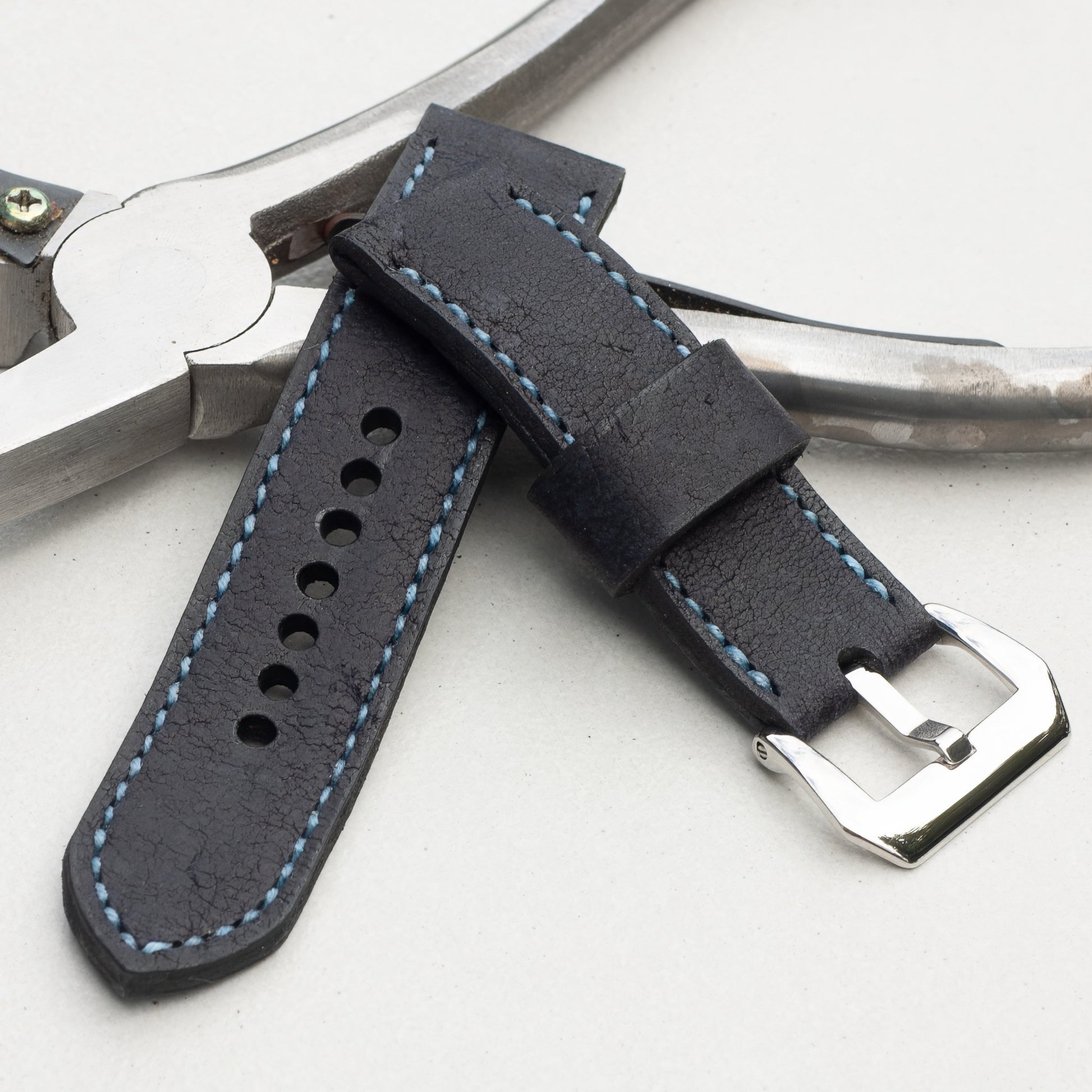 Midnight Kudu leather watch strap with pale blue stitching and polished steel buckle
