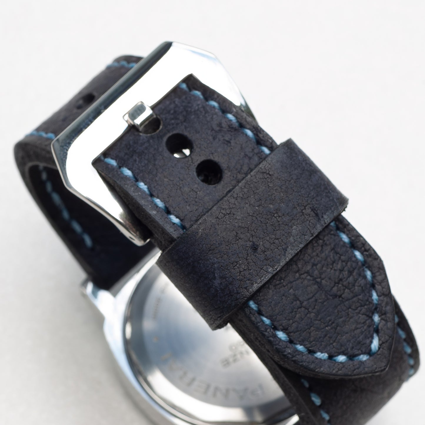 Midnight Kudu leather watch strap with pale blue stitching and polished steel buckle