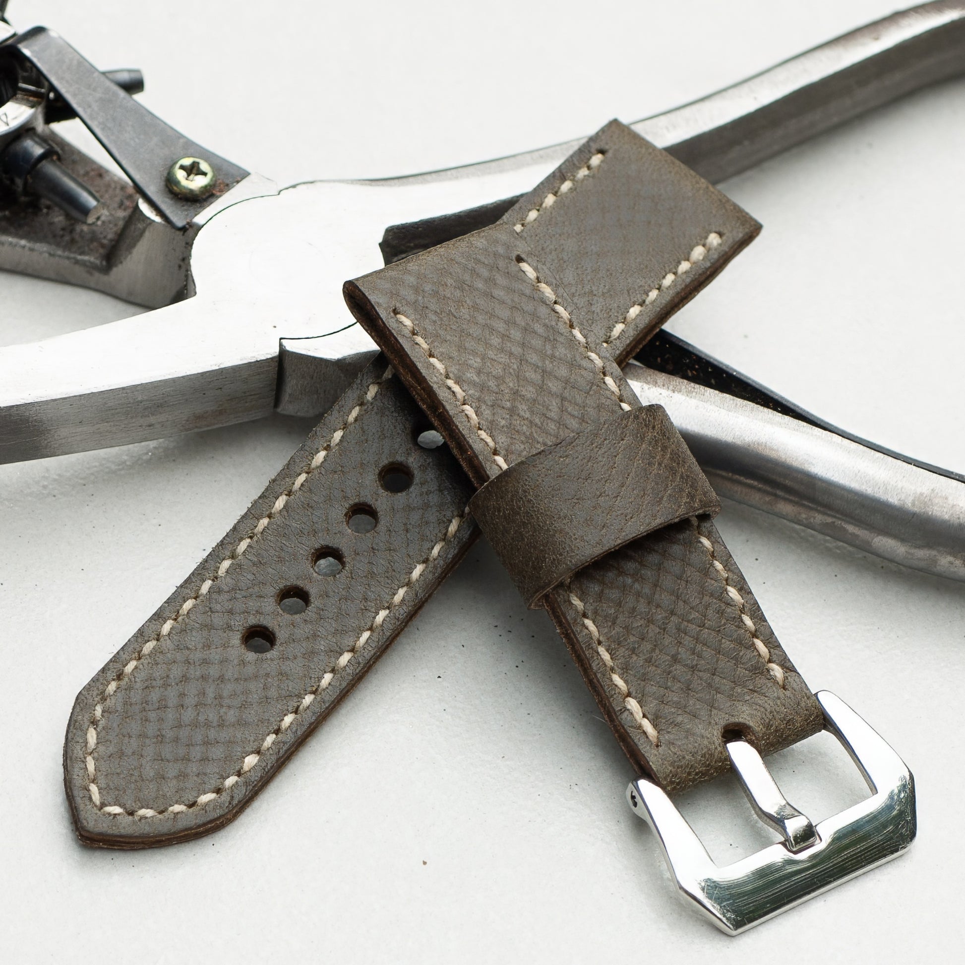 Moss Green leather watch strap with natural stitching and polished steel buckle