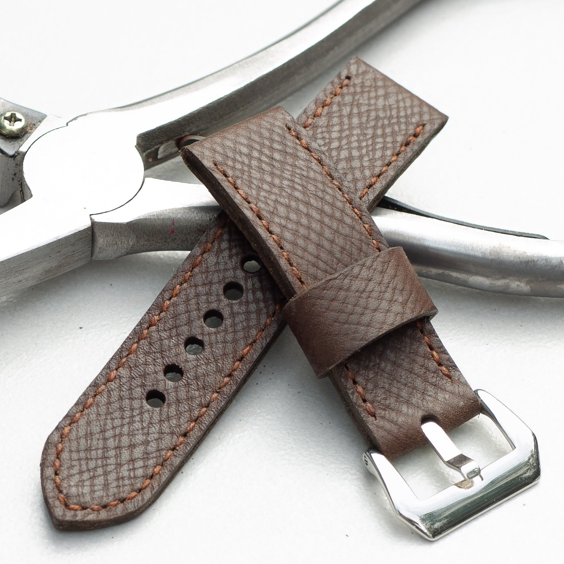Mushroom leather watch strap with light brown stitching and polished steel buckle