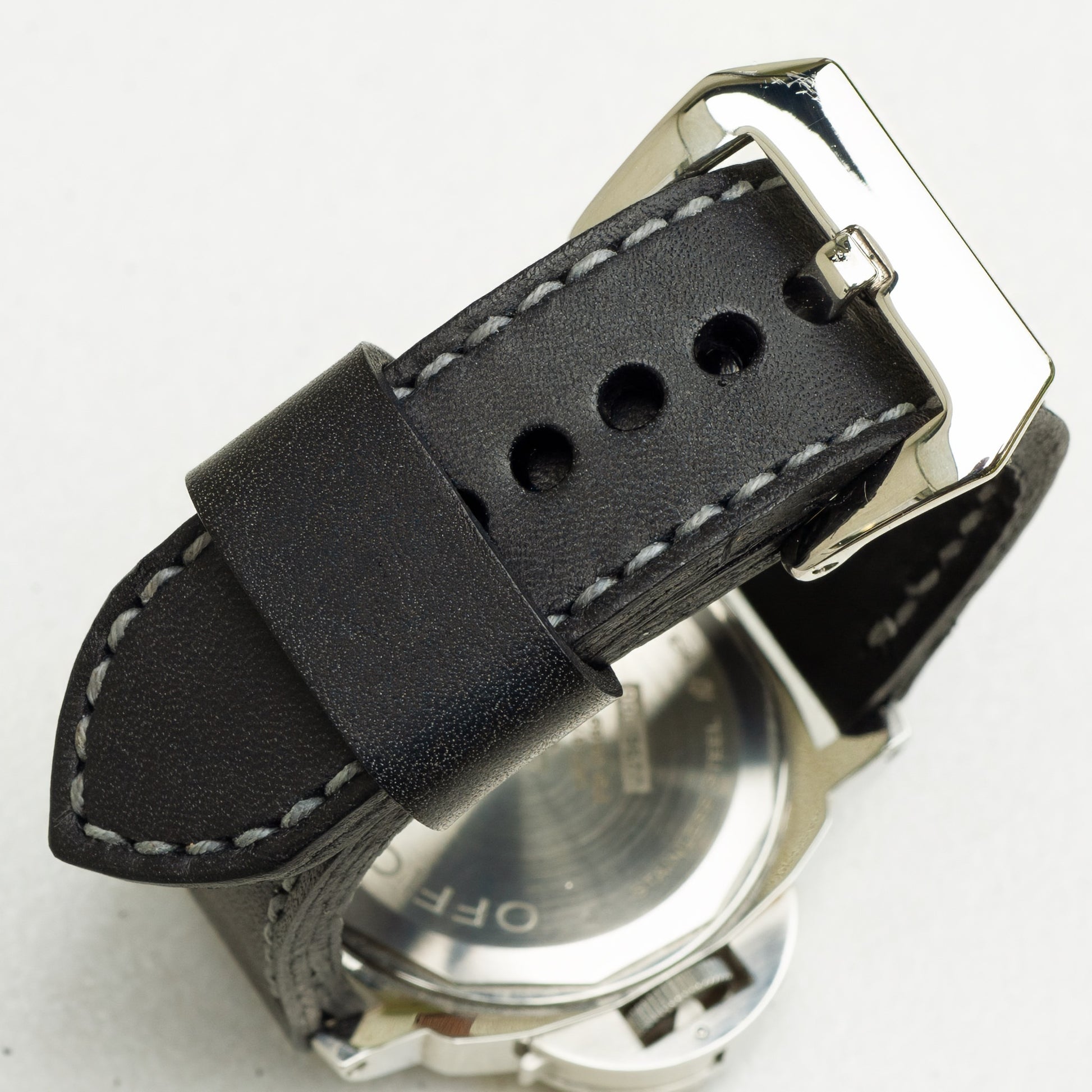 Nautilus leather watch strap with grey stitching and polished steel buckle