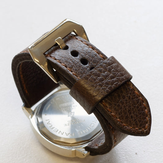 Nordic Ox leather watch strap with light brown stitching and polished steel buckle