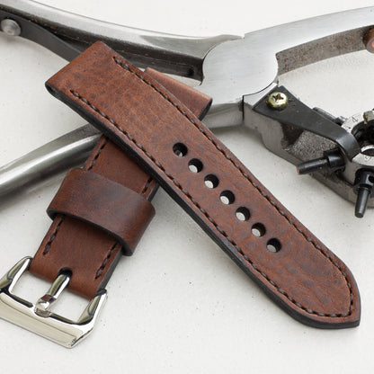 Horween Nut Brown leather watch strap with dark brown stitching and polished steel buckle
