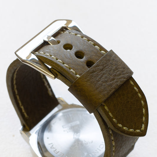 Oliva leather watch strap with olive drab stitching and polished steel buckle