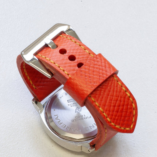 Orange Crush leather watch strap with bright yellow stitching and polished steel buckle