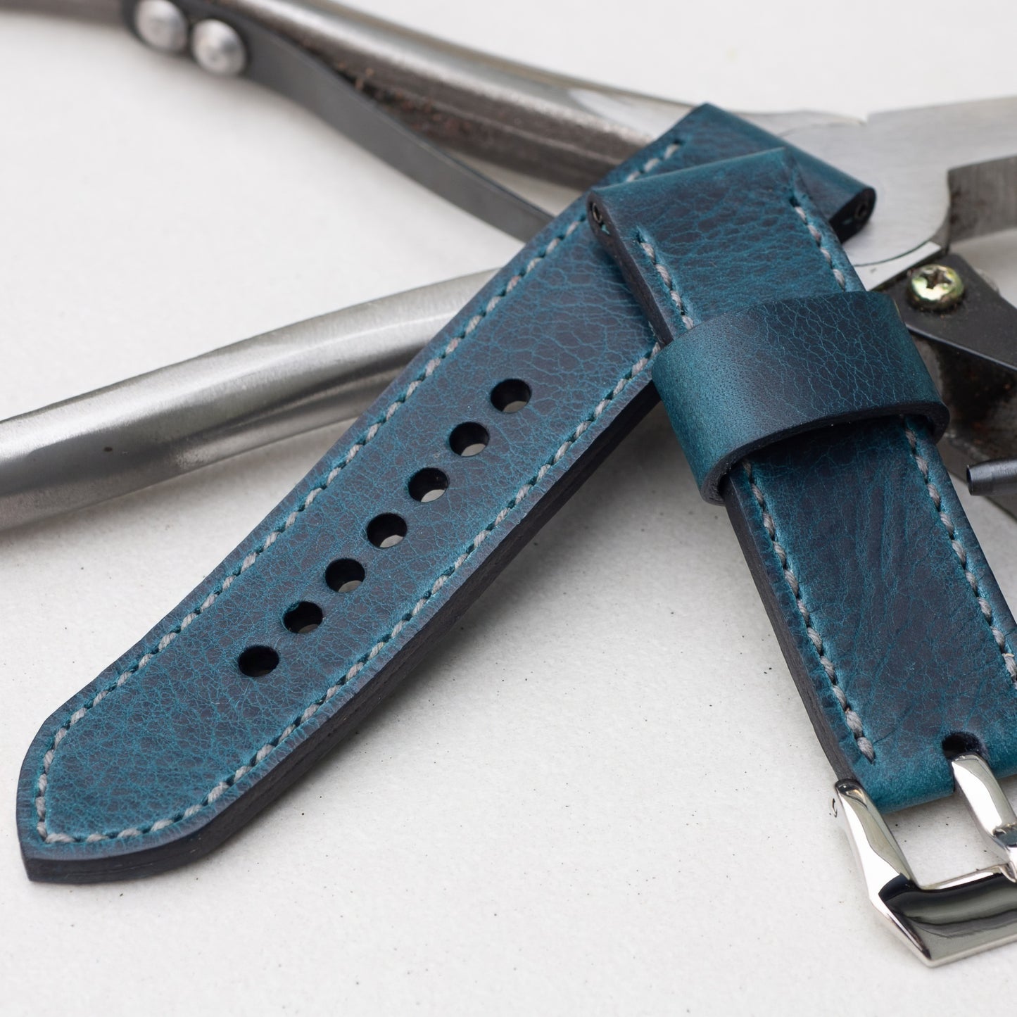 Ortensia leather watch strap with grey stitching and polished steel buckle
