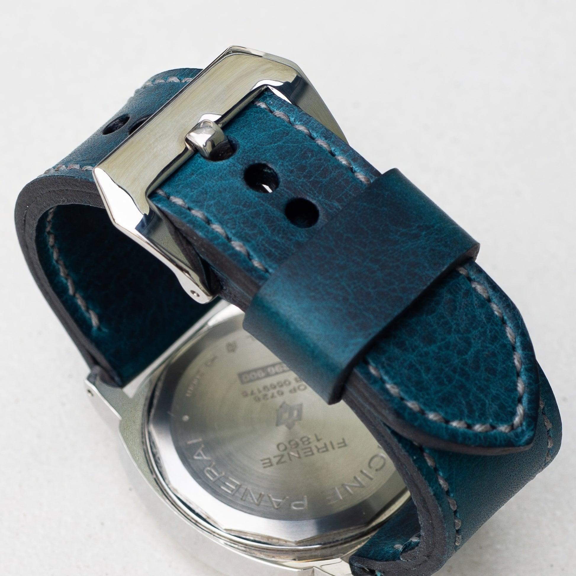 Ortensia leather watch strap with grey stitching and polished steel buckle